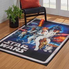 a star wars themed area rug on the floor with a chair and potted plant