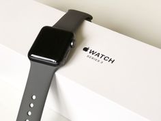 an apple watch sitting on top of a box