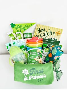 the st patrick's day gift basket is full of goodies, snacks and more