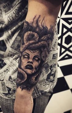 a man with a tattoo on his arm that has an image of a woman's face