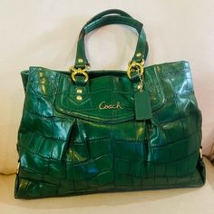 Euc - Coach Ashley Croc Embossed Green Leather Carry-All Bag. Features 3 Inner Compartments, 1 Zip Pocket, 2 Slip Pockets On The Inside, Fully Lined. Zipper & Magnetic Top Closure. Gold Hardware. Coach Hang Tag. Coach F1260-F20345. Approx Measurements : 15.75”L X 10.5”H X 3.5”W. Handle Drop : 7.5” Please Take Time To Check, Look At All Pictures As Part Description And Feel Free To Ask As Many Questions Or Doubts You May Have Before Bidding, Making An Offer Or Purchase. As All Sales Final. Thank Green Coach Satchel With Detachable Handle, Green Coach Shoulder Bag With Top Carry Handle, Green Coach Bags With Removable Pouch, Green Textured Leather Coach Bag, Coach Green Bag With Gold-tone Hardware, Carry All Bag, Take Time, Green Leather, Coach Bags