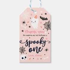 a pink gift tag with the words spooky one on it