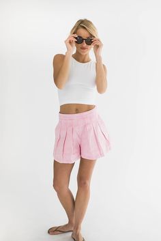 Embrace summer style with our Iris pleated cotton twill denim shorts in a sweet pink color. Featuring a flattering pleated front, convenient side zipper, and practical pockets, these shorts combine functionality with a chic, playful design. The soft cotton twill fabric ensures comfort, making these shorts a perfect addition to your warm-weather wardrobe. Why We Love Them: Chic Design: Flattering pleats and a stylish silhouette. Functional Details: Side zipper and practical pockets for convenience. Comfortable Fabric: Made from soft, breathable cotton twill. Styling Suggestions: White Tank Top: Keep it simple and fresh with a classic white tank. Striped Button-Down Shirt: For a casual yet polished look. Espadrilles: Add a touch of summer flair with a pair of espadrilles. Fabric content: 100 Denim Accessories, Twill Fabric, White Tank Top, Cotton Twill Fabric, White Tank, Playful Design, Polished Look, Chic Design, Classic White