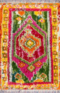 a colorful rug with fringes on the bottom and an orange, pink, green, yellow