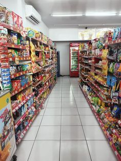 an aisle in a grocery store filled with lots of food