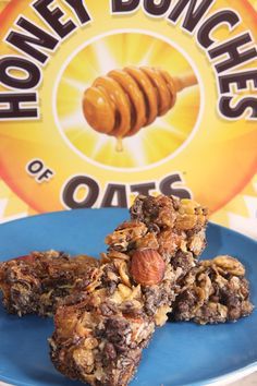 honey donuts on a blue plate next to a box of oatmeal