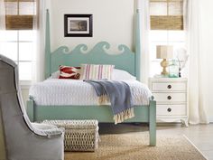 a bedroom with white walls and blue furniture