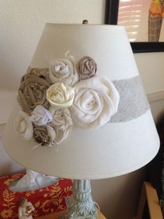 a lamp that has some flowers on it