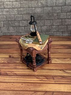 a miniature lamp on top of a wooden table