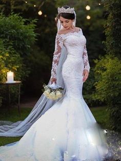 a woman in a wedding dress standing outside