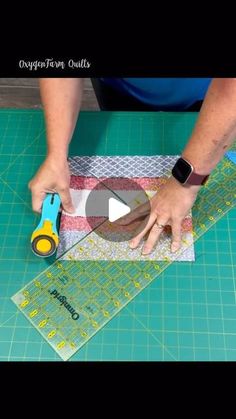 a person cutting up fabric with scissors