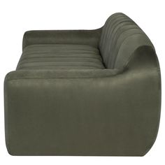 an olive green couch sitting on top of a white floor