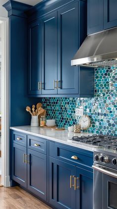 Coastal Kitchen Ideas Blue Kitchen Cabinets Ideas, Coastal Kitchen Lighting, Dark Blue Kitchen Cabinets, Blue Cabinetry, Dark Blue Kitchens, Slate Countertop, Cherry Wood Floors, Grey Blue Kitchen