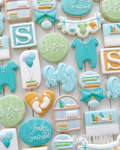 baby shower cookies are arranged on a table