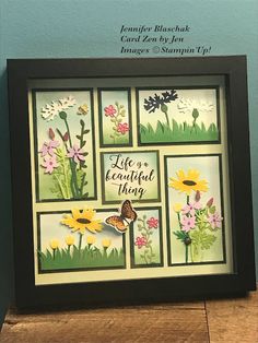 a picture frame with flowers and butterflies on it, saying life is a beautiful thing