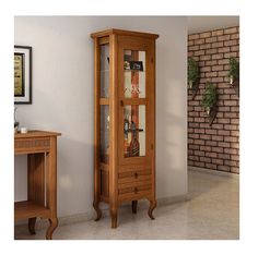 a tall wooden cabinet sitting next to a brick wall in a room with white walls