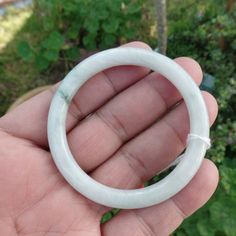 Bangle Measures 67.3 Mm From The Outside In Diameter, Measures 52.5 Mm From The Inside, Measures 7.5 Mm Thick, And Measures 7mm Wide, In Some Parts. And 26.50 Grams. W/Natural Inclusions, It's Unique And Delicate. Will Make A Special Gift. Please Make Sure It's The Right Size. Handmade White Jade Bracelets, White Jade Jewelry For Wedding, Handmade White Bracelets For Formal Occasions, Classic White Bangle Bracelet, Classic White Bangle Jewelry, White Bangle For Gift, Classic White Handmade Bracelets, White Handmade Bracelet, Jade Bangle Bracelet