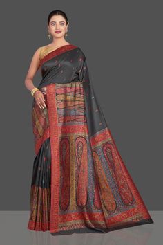 Shop stunning black tussar silk sari online in USA with multicolor Kani embroidery. Make your presence felt on special occasions in beautiful embroidered sarees, handwoven sarees, pure silk saris, tussar sarees from Pure Elegance Indian saree store in USA.-full view Black Traditional Wear With Kalamkari Print In Chanderi, Black Kalamkari Print Saree For Diwali, Black Chanderi Traditional Wear With Kalamkari Print, Festive Black Saree With Kalamkari Print, Unstitched Black Saree With Kalamkari Print, Festive Black Dupatta With Kalamkari Print, Black Bollywood Traditional Wear With Kalamkari Print, Bollywood Style Black Dupatta With Kalamkari Print, Black Kalamkari Print Saree