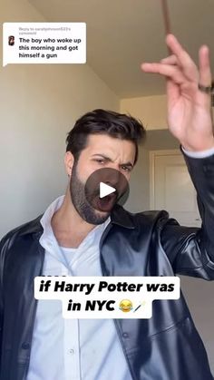 a man in a leather jacket holding his hand up to say if harry potter was in nyc