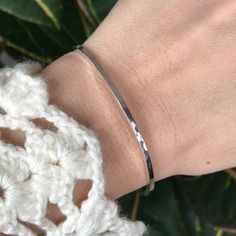 "This will become your go-to boho bangle! This sterling silver square wire bangle has been hand forged and hammered to give it it's subtle faceted effect allowing the light to reflect off of it. A bohemian piece that's easily stackable with other bracelets and bangles. To wear, simply slide it over your hand. {LISTING FEATURES} ~ Boho luxe style ~ Solid sterling silver ~ Square pattern ~ Shiny finish ~ Hammered texture ~ Approx. 2mm thick ~ Can be worn alone or easily stacked with my other brace Adjustable Sterling Silver Bangle For Everyday, Adjustable Everyday Sterling Silver Bangle Bracelet, Minimalist Adjustable Nickel-free Cuff Bracelet, Adjustable Rectangular Sterling Silver Bracelet Gift, Adjustable Hammered Everyday Bracelets, Rectangular Adjustable Sterling Silver Bracelet Gift, Adjustable Nickel-free Bangle For Everyday, Nickel-free Bangle Bracelet For Everyday, Nickel Free Adjustable Everyday Bangle