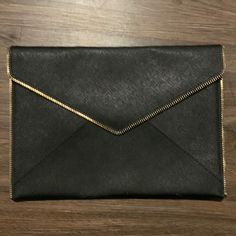 Rebecca Mincoff Black With Gold Edging Clutch Purse Nwot. Never Used. 11 Wide By 8 Tall. Snap Closure. Black Party Bags For Fall, Chic Fall Bags For Night Out, Versatile Black Clutch For Office, Black Versatile Clutch For Office, Black Clutch Bag For Work, Trendy Black Clutch For Office, Chic Black Clutch, Black Envelope Clutch For Office, Elegant Black Clutch With Magnetic Closure