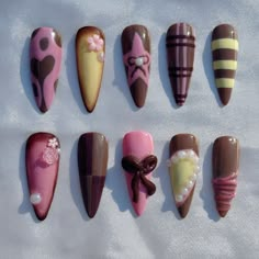 These hand painted press ons are inspired by Valentine's Day and sweet treats. Features hand sculpted 3D details. Cute Fall Themed Nails, Crazy Nail Sets, Sweet Nails Designs, Neopolitan Nails, Flannel Nail Art, Kawaii Short Nails, Art Nails Design Ideas, Pink And Brown Nails, Nail Designs Step By Step