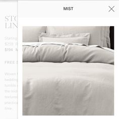 an image of a bed with white sheets and pillows on the bottom right hand corner