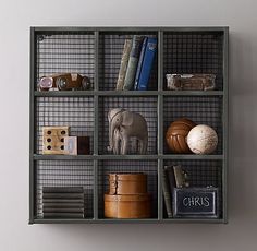 a book shelf with books and other items on it, including an elephant figurine