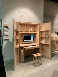 a wooden desk with a computer on top of it