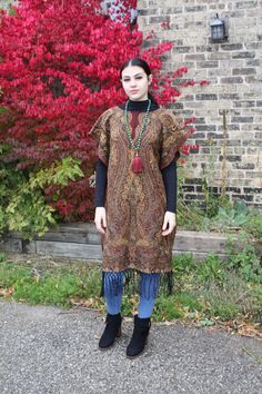 "❥Pashmina Ethnic Print Tunic, hand made using a large scarf/wrap ❥Material is thick and warm for fall/winter ❥open at the sides from hip down for easily slipping on and off ❥Beautiful Indian beaded Print ❥inspired by boho hippie fashion ❥fits size small/medium/large ❥measurements bust fits up to 42\" Hips fit up to 44\" Sleeve is open model is size small medium, this will also fit a large (i am 42\" bust and 44\" hip and this fits me loosely as well :) ❥shipping -All shipping within CANADA and Bohemian Shawl For Winter Festival, Bohemian Shawl Poncho For Fall, Bohemian Winter Shawl For Festivals, Bohemian Winter Festival Shawl, Hippie Winter Shawl, Hippie Shawl For Fall, Hippie Shawl One Size For Fall, Fall Festival Poncho Shawl, Hippie Shawl For Fall, One Size