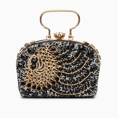 Decked out in magnificent peacock-patterned rhinestones, this clutch exudes unparalleled uniqueness and flair. Beyond its stunning appearance, it blends functionality seamlessly with style, featuring a chic chain strap and ample interior space. Its splendid design encapsulates sophistication, guaranteeing that every graceful movement catches the eye and turns heads. Now available in gold, and black. Chic Evening Bag With Bling For Night Out, Glamorous Clutch With Rhinestones For Night Out, Rhinestone Clutch For Night Out, Luxury Rhinestone Evening Bag For Party, Luxury Rhinestone Party Evening Bag, Glamorous Rhinestone Clutch For Night Out, Glamorous Rhinestone Clutch For Formal Events, Glamorous Rhinestone Formal Clutch, Glamorous Rhinestone Party Clutch