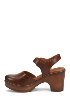 A woodgrain platform heel on a clog-inspired pump brings retro style to your ensembles. 3" heel Round toe Adjustable slingback strap with buckle closure Cushioned footbed Synthetic upper and lining, rubber sole Imported Brown Ankle Strap Platform Clogs, Brown Platform Slingback Pumps With Open Heel, Brown Slingback Pumps With Ankle Strap And Platform, Brown Platform Slingback Pumps, Brown Platform Slingback Pumps With Ankle Strap, Platform Heel, Platform Pumps, Platform Heels, Women's Pumps