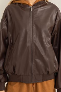 Introducing the "Brooklyn" leather bomber jacket, crafted with a drop shoulder and oversized fit for maximum style and comfort. This versatile jacket is perfect for any occasion and is made of quality vegan leather! It has side slit pockets Leather Jacket Brown, Versatile Jacket, Shoe Gifts, Brown Leather Jacket, Oversized Silhouette, Dress Jewelry, Drop Shoulder, Baby Shop, Front Zipper