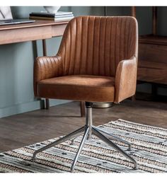 a brown office chair sitting on top of a rug