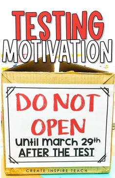 an open box with the words testing motivation written in red and black on it, next to a sign that reads don't open until march 29 after the test