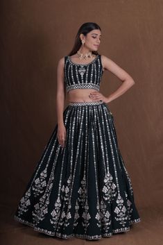 Introducing our collection of Indian ensembles, designed for every memorable moment. Explore our offerings, including attire for the joyful Haldi ceremony, graceful Bridesmaids' Lehenga Choli, intricate Mehendi ensembles, enchanting Engagement Ceremony Lehenga Choli, rhythmic Sangeet Ceremony Lehenga Choli, traditional Tilak/Sagan Ceremony outfits, radiant Haldi Ceremony Lehenga Choli, sophisticated Reception Lehenga Choli, heartfelt Blessing Ceremony ensembles, and opulent Indian wedding attire. We cater to all your occasion wear needs. Green zari Work Embroidery Lehenga Choli Indian Mahendi Ceremony Wear Ready to wear lengha choli Traditional Wear Ghagra Choli We Customise all designs in any sizes and pattern for top and blouse  LEHENGA (Semi-Stitched): FABRIC TYPE : Faux Georgette WORK Dori Work Sets For Diwali Reception, Cutdana Sets For Diwali Reception, Reception Sets With Cutdana For Diwali, Festive Art Silk Sets With Mirror Work, Bollywood Style Dori Work Sets For Diwali, Semi-stitched Sets For Reception During Navratri, Festive Art Silk Choli With Mirror Work, Traditional Palazzo Set With Unstitched Blouse For Navratri, Unstitched Sets For Reception And Navratri