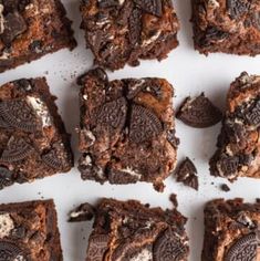 brownies with oreo cookies and white chocolate chips on top are cut into squares