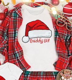 Just a few of the items we offer:  Matching Christmas Shirt, Matching Family Shirts, Christmas Shirts, Matching Holiday Shirts, Family Christmas Shirts, Family Holiday Shirts, Believe Christmas Shirt, Christmas Believe Shirt, Christmas Party Shirt, Christmas T-Shirt, Christmas Family Shirt, Believe Shirt, Ugly Christmas Sweater, Santa's Ho Ho Ho Tshirt, Christmas Shirt, Matching Christmas, Christmas Pajamas, Christmas Movie, Christmas Gift, Unisex Heavy Cotton Tee, Custom T-Shirt, Christmas T-Shirt, Trending T-Shirt, Popular Christmas Shirt, Holiday Tee, Winter Tee, Cute Christmas T-Shirt, Merry & Bright, Holiday Matching Shirt. What a wonderful way to celebrate this beautiful time of the year! You can choose to add a name or leave the design as it is. You can order any combination for eac Matching Family Christmas Outfits, Family Christmas Outfits, Winter Tees, Matching Family Christmas Pajamas, T Shirt Time, Matching Christmas Shirts, Christmas Party Shirts, Family Christmas Pajamas, Family Christmas Shirts