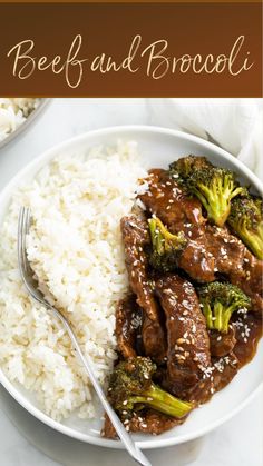 beef and broccoli served with rice on a white plate, next to a fork