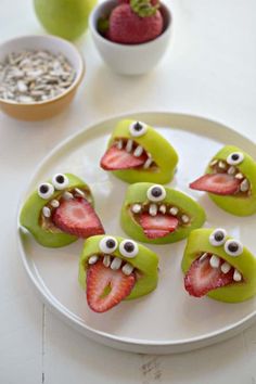 there are pictures of different food items with eyes and mouth designs on them, including strawberries