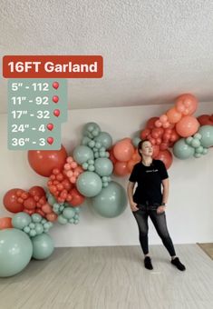 a woman standing in front of balloons on the wall