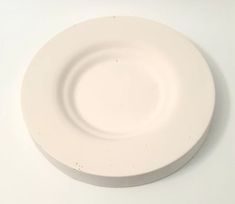 a white plate sitting on top of a table