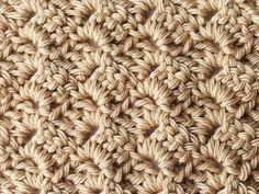 the crochet pattern is shown in beige