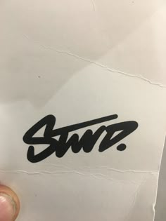 someone is holding up a piece of paper with the word swrz on it