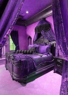 a bedroom with purple walls and an ornate bed in the center, along with two nightstands on either side