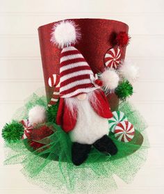 a red and white santa claus hat with candy canes