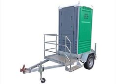 a small green and gray portable toilet sitting on top of a trailer