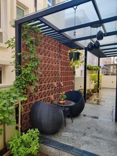 an outdoor patio area with plants and furniture