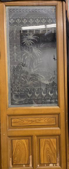 a wooden door with an artistic painting on it