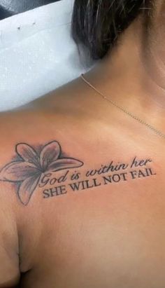 a woman with a tattoo on her chest saying god is within her she will not fail